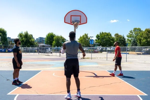 basketball player shooting three pointer